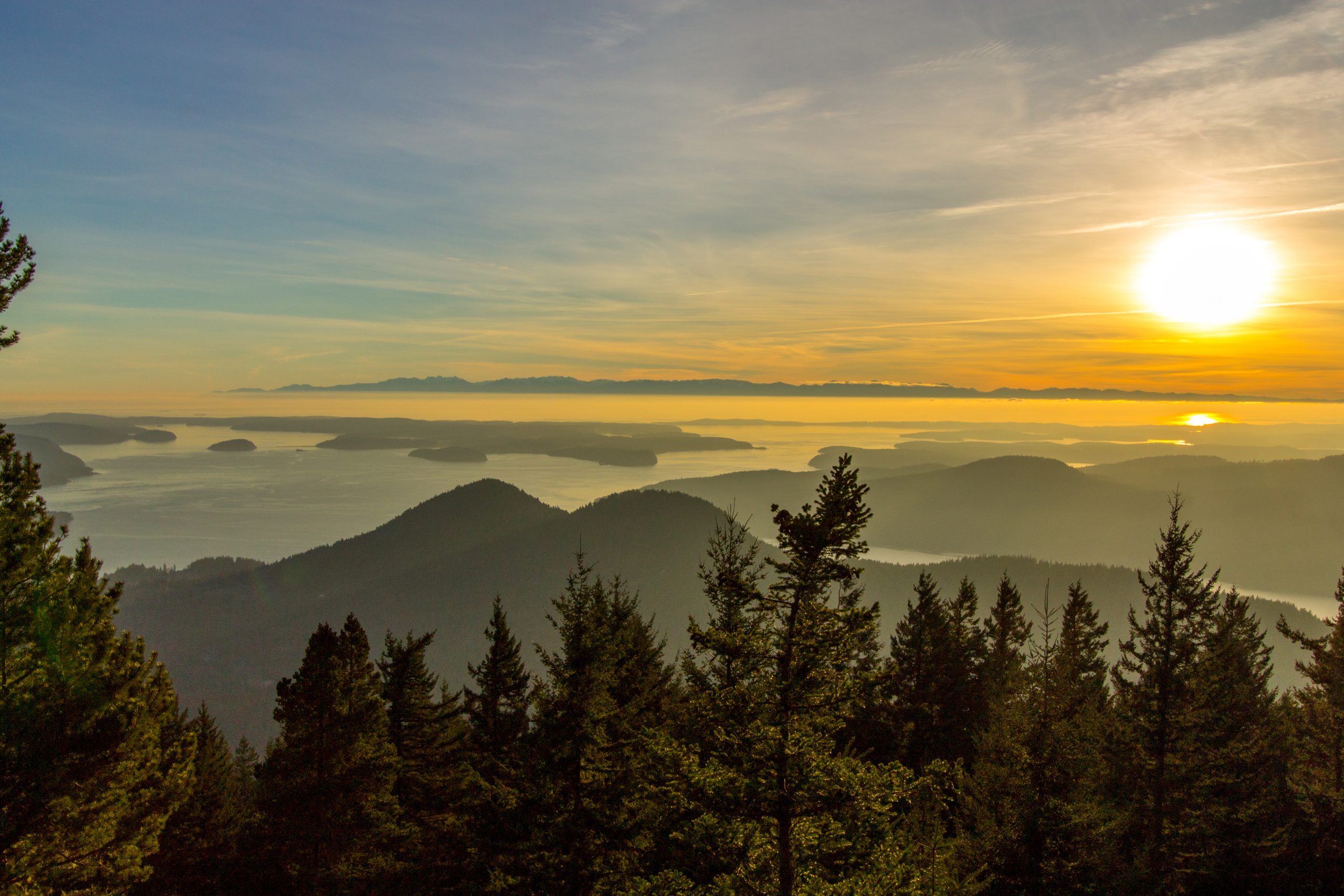 Sunset Orcas Island pacific northwest.  Mountain trees and the puget sound sea ocean